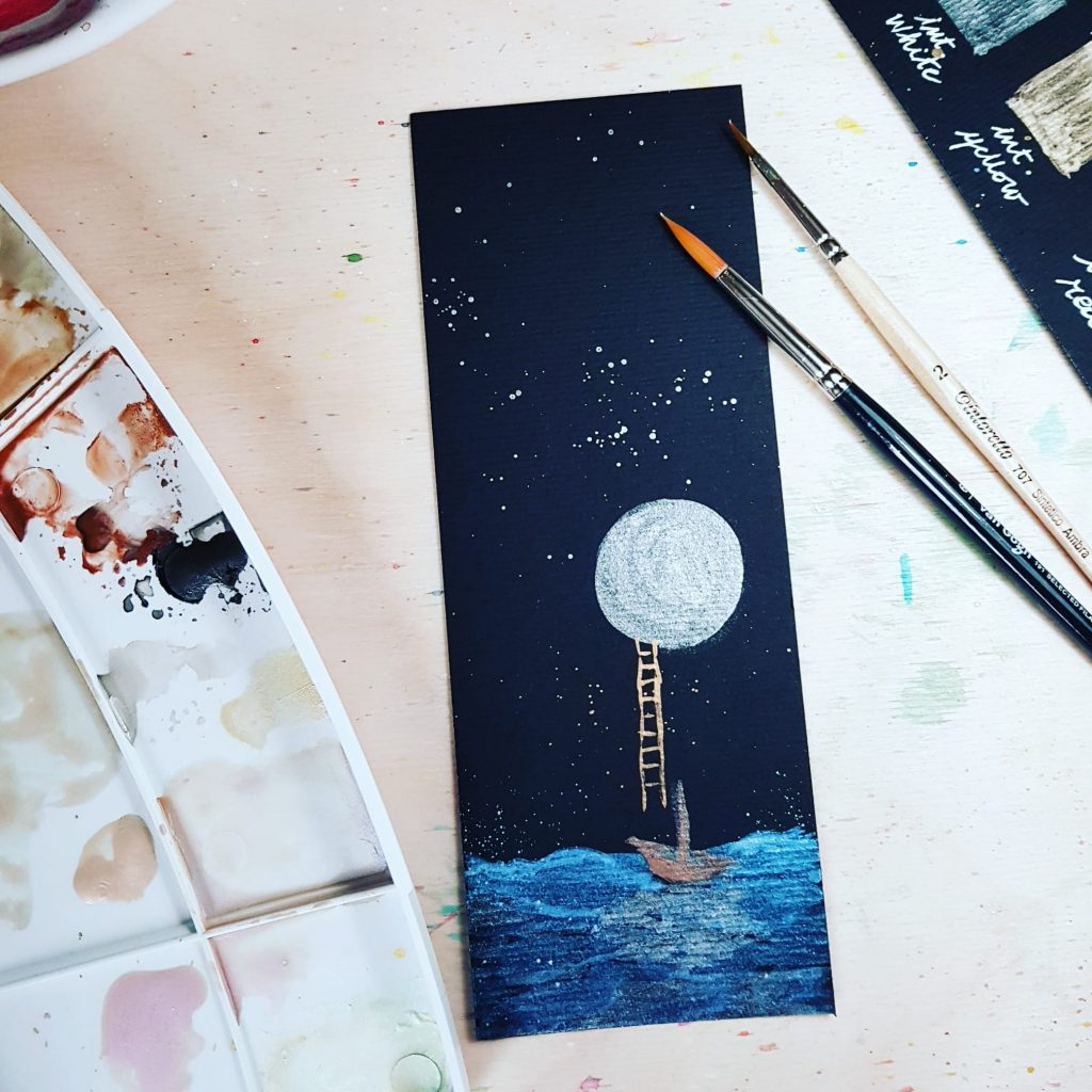 La luna ed il mare su carta nera